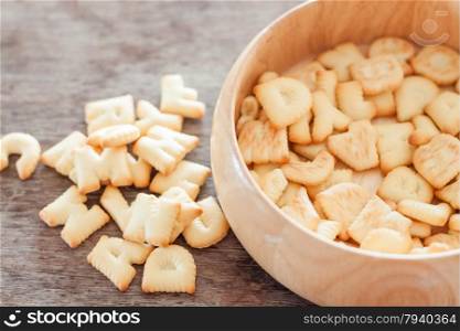 Alphabet biscuit in wooden tray, stock photo