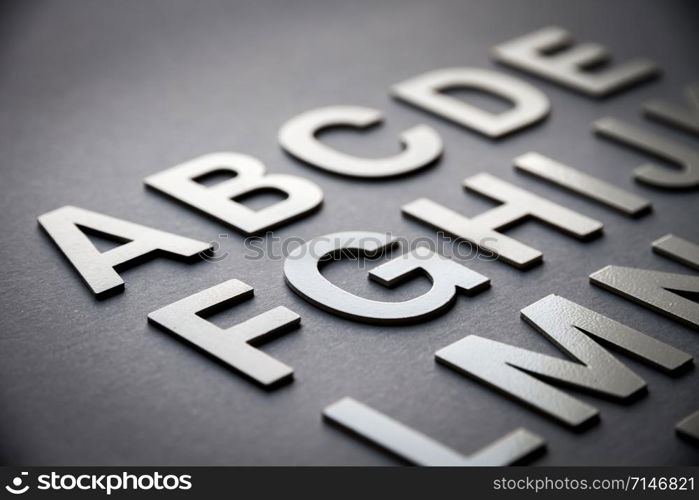 Alphabet detail made with solid letters on a blackboard. Alphabet made with solid letters