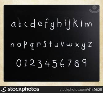 ""Alphabet" handwritten with white chalk on a blackboard"