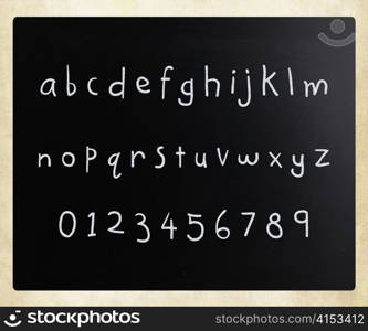 ""Alphabet" handwritten with white chalk on a blackboard"