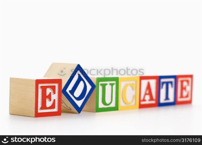 Alphabet toy building blocks spelling the word educate.