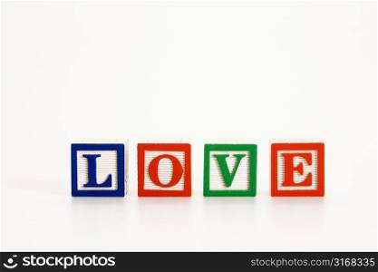 Alphabet toy building blocks spelling the word love.