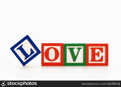 Alphabet toy building blocks spelling the word love.