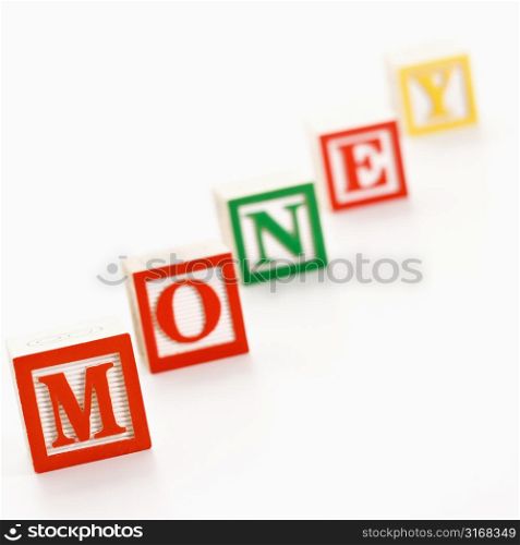 Alphabet toy building blocks spelling the word money.