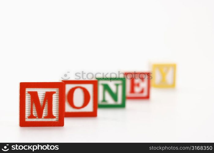 Alphabet toy building blocks spelling the word money.