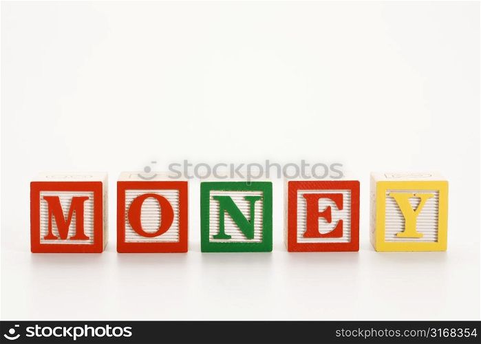 Alphabet toy building blocks spelling the word money.