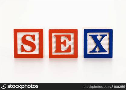 Alphabet toy building blocks spelling the word sex.