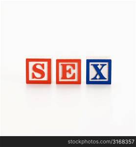 Alphabet toy building blocks spelling the word sex.