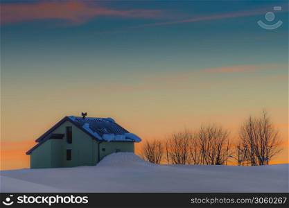 alpin hut in the snow