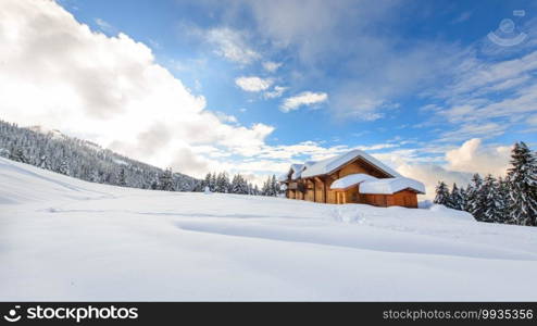 Alpine hut in the midst of lots of snow on the Italian Alps