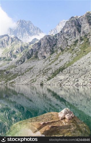 Alpine lake close to the path to the top of Monviso mountain, one of the most scenic mountain of Alps