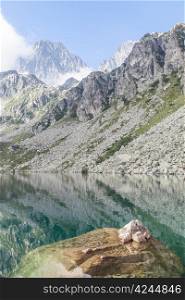 Alpine lake close to the path to the top of Monviso mountain, one of the most scenic mountain of Alps