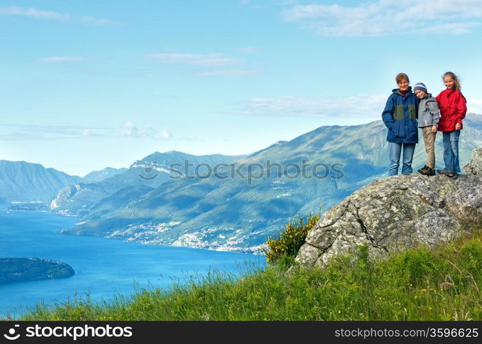 Alpine Lake Como summer view from mountain top and family (Italy)