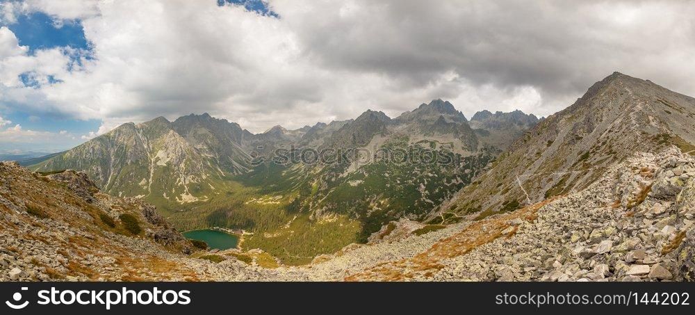 Alpine lake Popradske pleso in the morning with a great view on Tatra mountains.. Panorama of Popradske pleso lake valley in Tatra Mountains, Slovakia, Europe