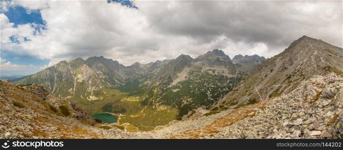 Alpine lake Popradske pleso in the morning with a great view on Tatra mountains.. Panorama of Popradske pleso lake valley in Tatra Mountains, Slovakia, Europe