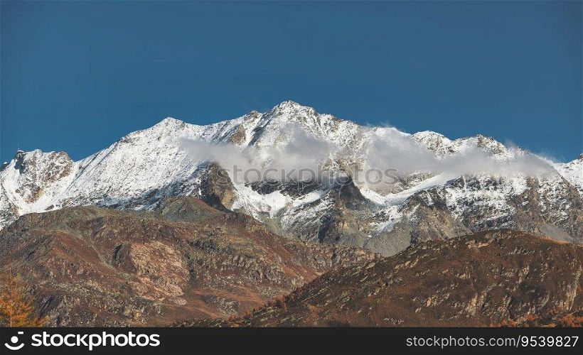 Alpine landscape on Swiss alps with first snow in altitude