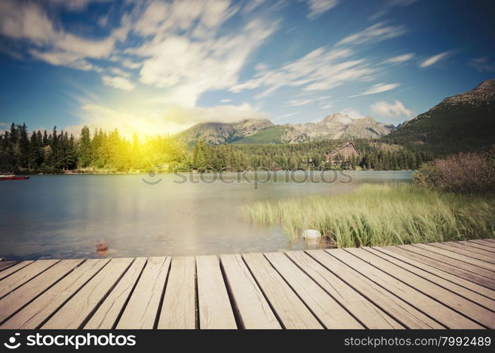 Alpine mountain lake at sunny day