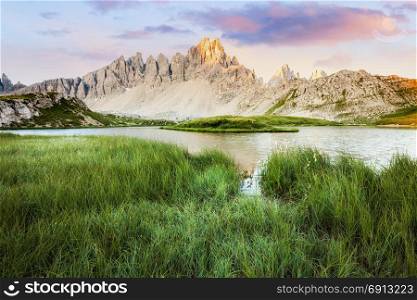 Alpine mountain lake at sunny morning, Tre Cime, Italian Dolomites