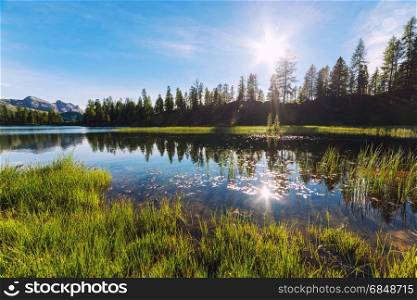 Alpine mountain summer lake at sunny day. Dolomites Alps, Italy