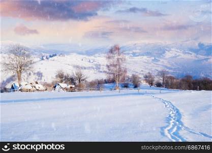 Alpine village at winter mountain snowy hills