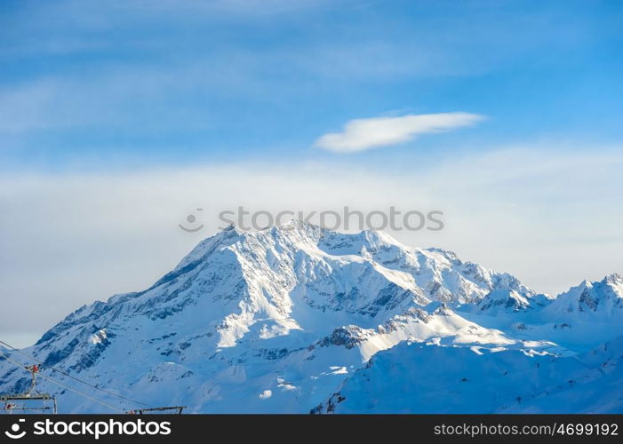 Alpine winter mountain landscape. French Alps covered with snow in sunny day. Val-d'Isere, France