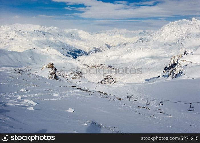 Alpine winter mountain landscape. French Alps covered with snow in sunny day. Val-d&rsquo;Isere, France