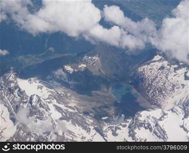 Alps glacier. Aerial view of a glacier and lake in Alps mountains