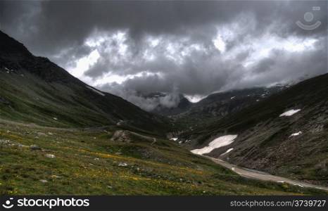 Alps mountain in europe summer vacation under dramatic sky