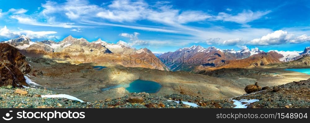 Alps mountain landscape and mountain lake in a beautiful day in Switzerland