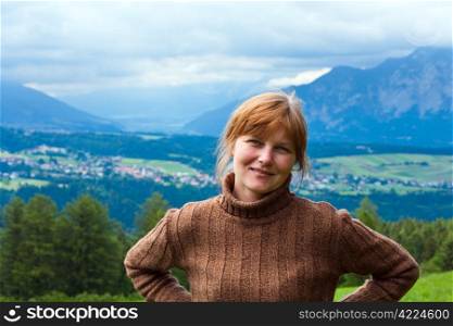Alps mountains summer village in valley (Austria) and woman portrait