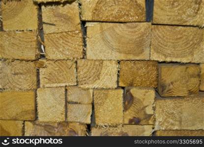 already cut firewood stacked on a wall