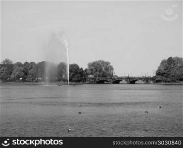 Alsterfontaene (Alster Fountain) at Binnenalster (Inner Alster lake) in Hamburg bw. Alster Fountain at Binnenalster (meaning Inner Alster lake) in Hamburg, Germany in black and white