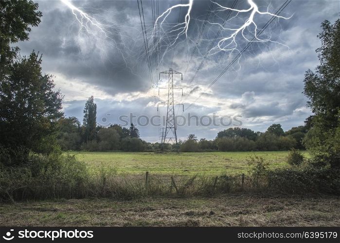 Alternate solar power conceptual landscape image of lightning hitting electricity pylon