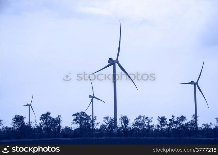 Alternative energy wind turbines. Toned.