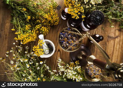 Alternative medicine and Natural remedy. Herbal medicine on wooden desk background