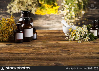 Alternative medicine and Natural remedy. Herbal medicine on wooden desk background