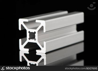 Aluminium profile sample isolated on black background.