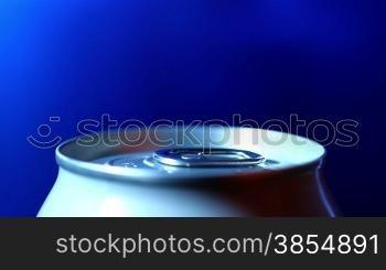 aluminum drink can on a blue background. shot motorized slider.