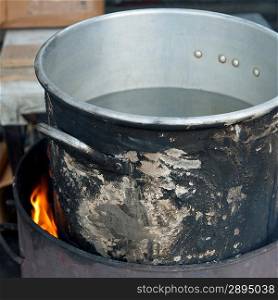 Aluminum pot on fire, Colonia Landivar, Guatemala City, Guatemala
