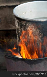 Aluminum saucepan on fire, Colonia Landivar, Guatemala City, Guatemala