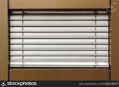 aluminum white blinds on the window