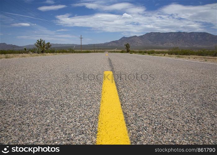 Always straight ahead road through dry endless space