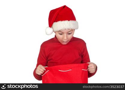 Amazed boy looking in the Christmas bag isolated on white background