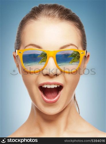 amazed girl in shades with beach reflection