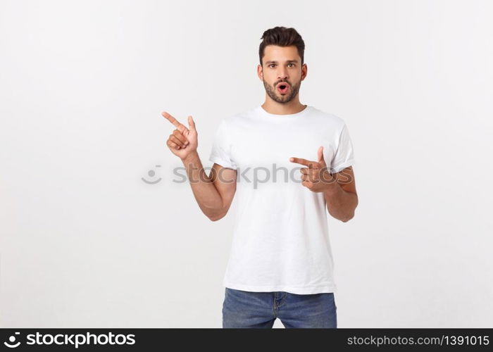 Amazed smart man pointing up at copy space over white background. Amazed smart man pointing up at copy space over white background.