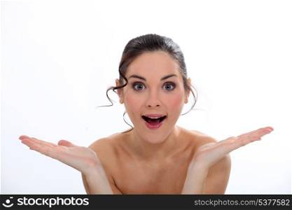 Amazed woman with bare shoulders