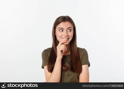 amazement - woman excited looking to the side. Surprised happy young woman looking sideways in excitement. Mixed race Asian and white Caucasian female model on grey background. amazement - woman excited looking to the side. Surprised happy young woman looking sideways in excitement. Mixed race Asian and white Caucasian female model on grey background.