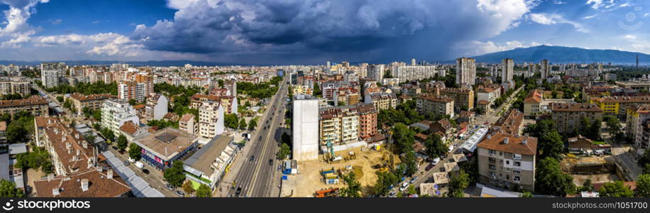 Amazing aerial panorama from a drone of city Sofia with stormy clouds, Bulgaria