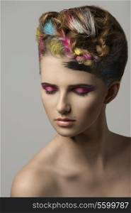 amazing beauty portrait of splendid girl with colorful painted hair-style and creative make-up.