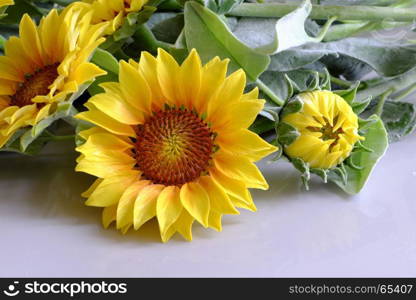 Amazing clay flower, handmade product for home decor, sunflower bouquet bloom in yellow and green leaf on white background, beautiful artificial flower